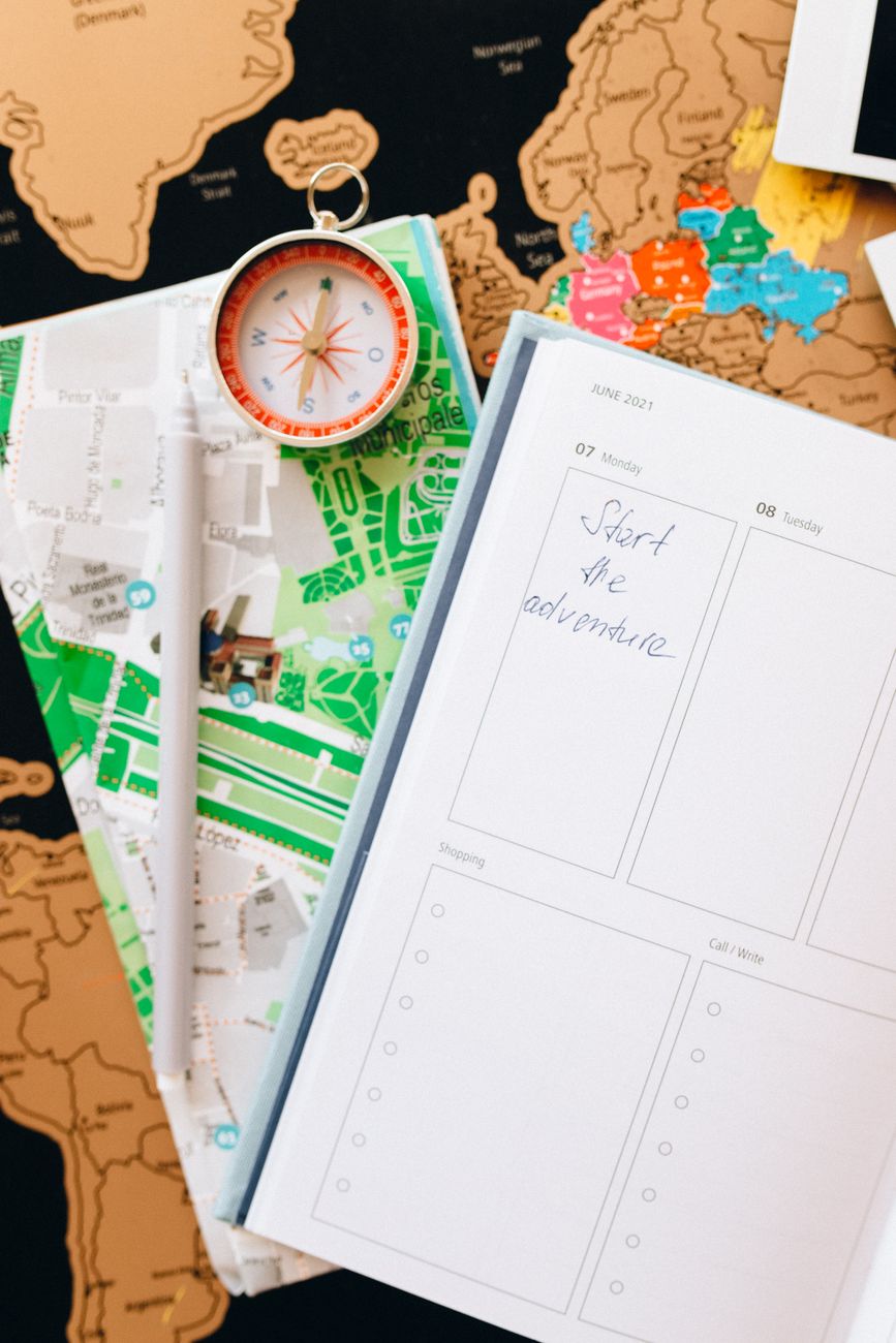 Custom travel itinerary planning notes with fine fountain pen on textured paper